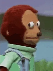 Monkey puppet looking away awkwardly